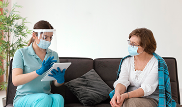Doctor providing Acute Illness Care Services to a patient in a modern primary care clinic